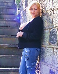 More outdoors flashing from tara sparx wearing jeans and a top
